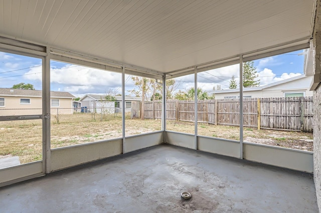 unfurnished sunroom featuring a wealth of natural light