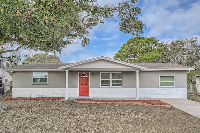 ranch-style home featuring a porch