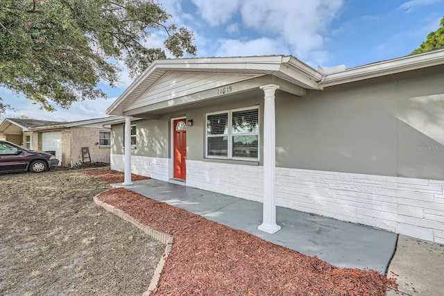 doorway to property with a porch