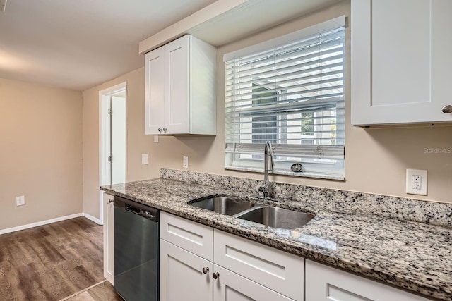 kitchen featuring dishwasher, dark wood-type flooring, sink, light stone counters, and white cabinetry