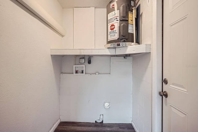 laundry room with washer hookup and water heater