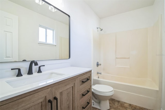 full bath featuring toilet, vanity, and  shower combination