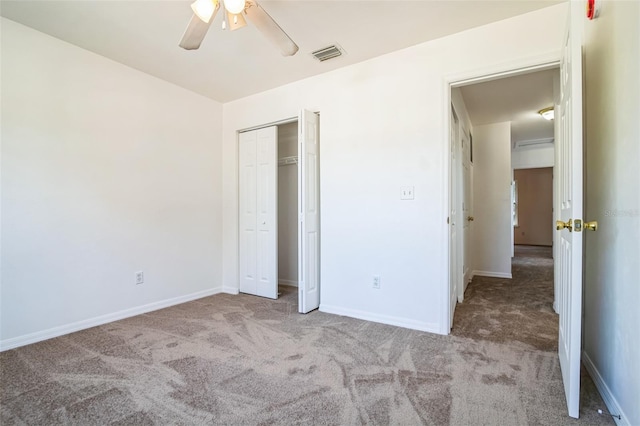 unfurnished bedroom featuring visible vents, a ceiling fan, a closet, carpet flooring, and baseboards