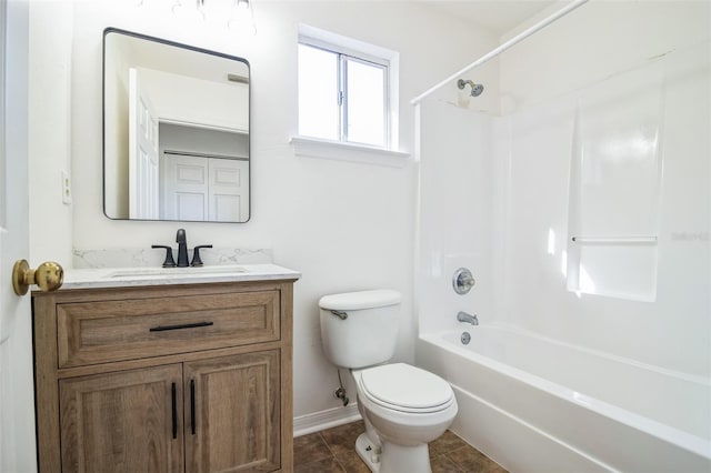 full bath with vanity, baseboards, tile patterned flooring, shower / tub combination, and toilet