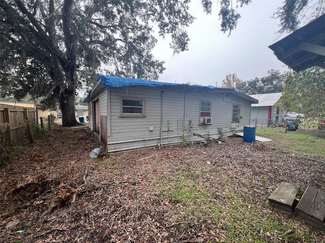 rear view of property featuring cooling unit