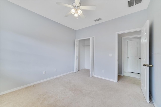 unfurnished bedroom with ceiling fan and light carpet