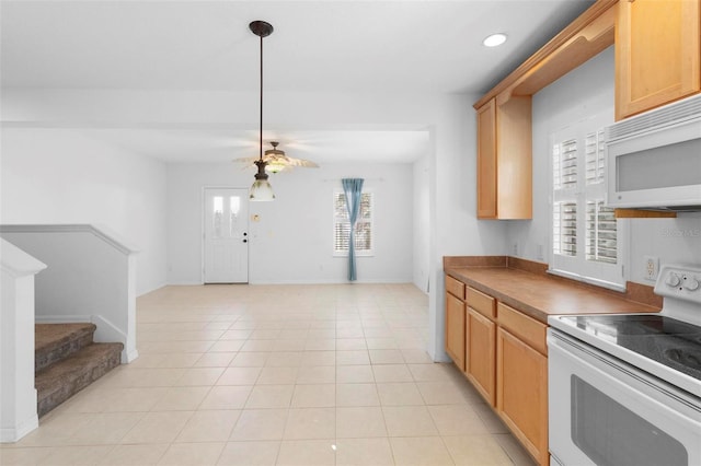 kitchen with ceiling fan, light tile patterned floors, and white appliances