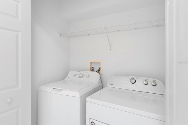 laundry room with independent washer and dryer