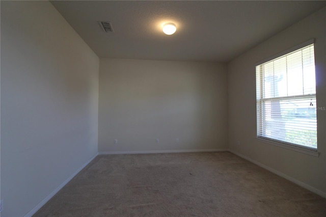 unfurnished room with carpet