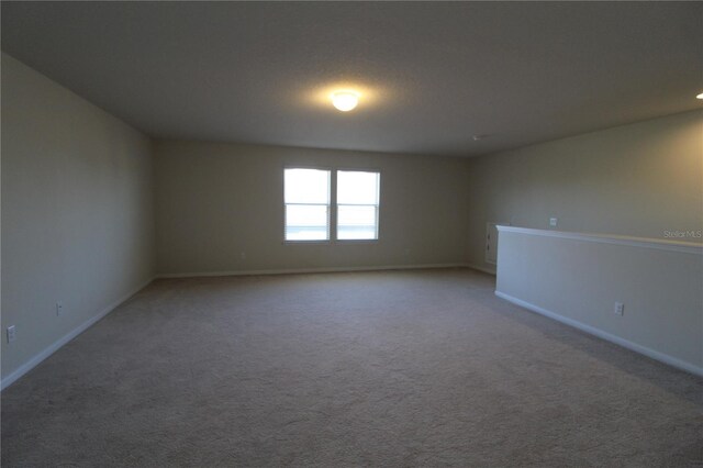 684 Bishop Bay Loop, Apopka, FL 32712 - unfurnished room with light colored carpet and baseboards