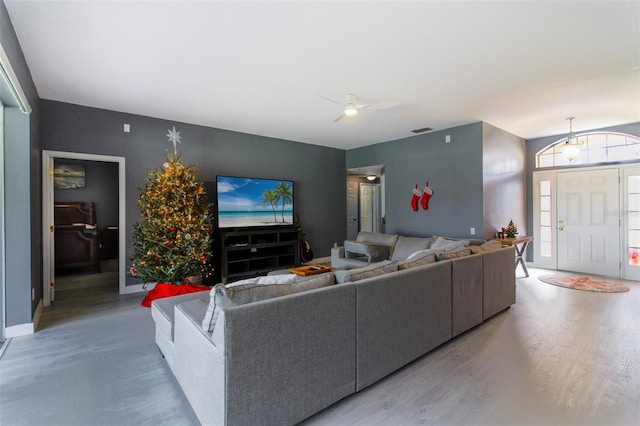 living room with hardwood / wood-style floors and ceiling fan