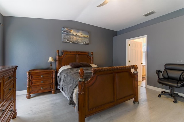 bedroom with light wood-type flooring, vaulted ceiling, and ceiling fan