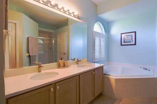 bathroom featuring tile patterned floors, vanity, and independent shower and bath