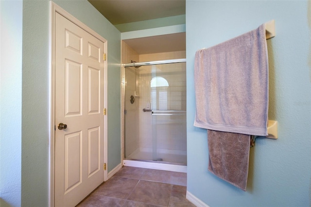 bathroom featuring tile patterned floors and walk in shower