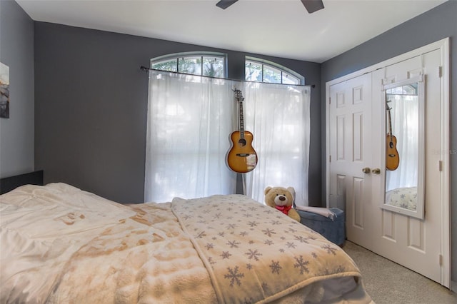 bedroom with ceiling fan, a closet, and carpet