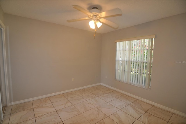 spare room featuring ceiling fan