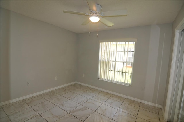 spare room featuring ceiling fan