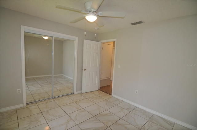 unfurnished bedroom with a closet and ceiling fan