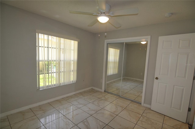 unfurnished room featuring ceiling fan