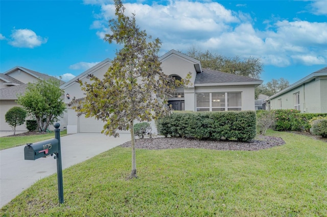 obstructed view of property featuring a front yard and a garage