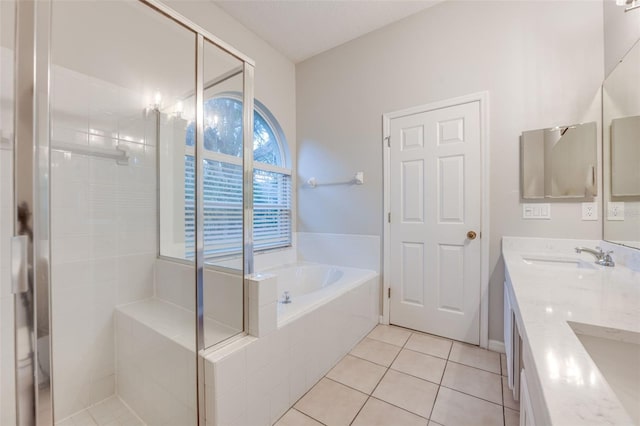 bathroom with tile patterned flooring, vanity, and independent shower and bath