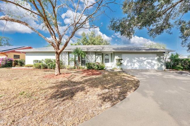 ranch-style home with a garage