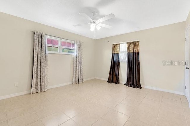 unfurnished room featuring ceiling fan