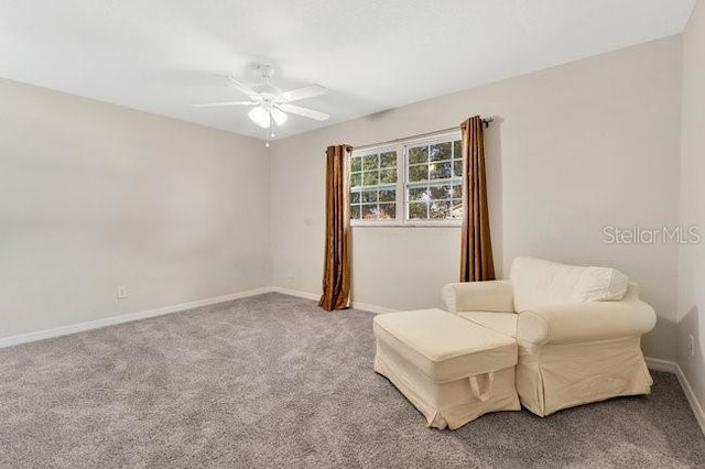 sitting room featuring carpet flooring and ceiling fan