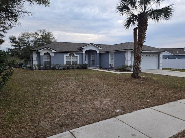 ranch-style house with a front lawn and a garage