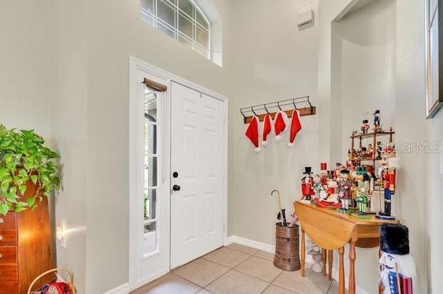 entrance foyer with light tile patterned floors