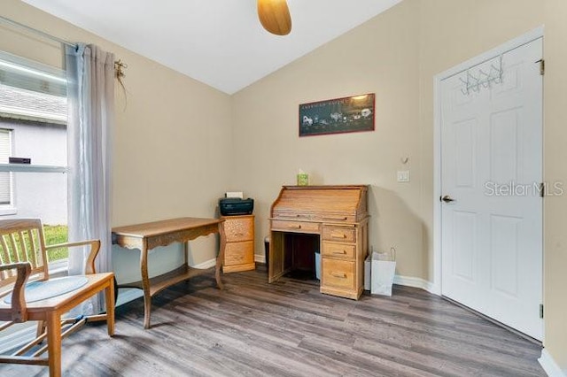 home office with ceiling fan, vaulted ceiling, and dark wood-type flooring