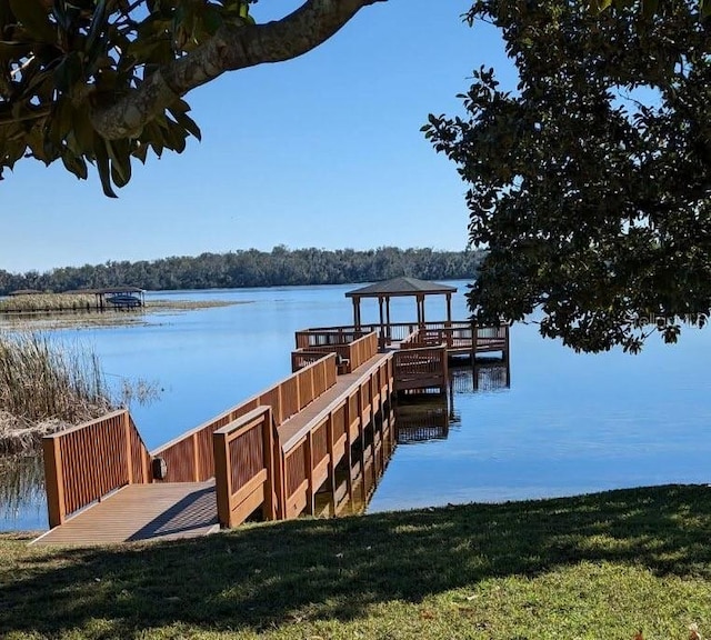 dock area with a water view and a gazebo