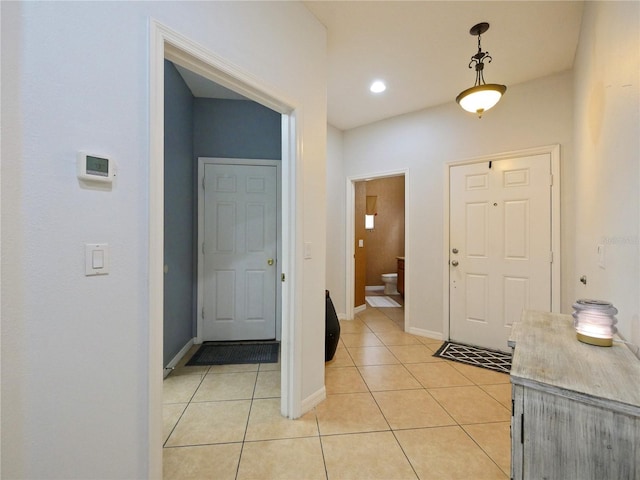 foyer entrance with light tile patterned floors