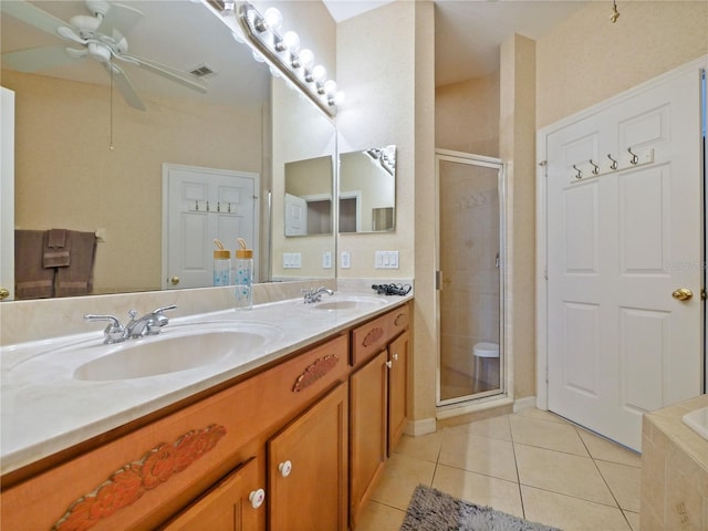 bathroom with ceiling fan, tile patterned flooring, vanity, and shower with separate bathtub