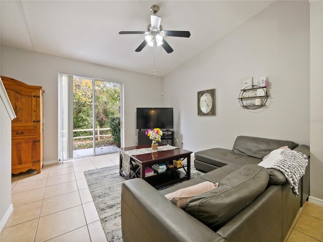 tiled living room featuring ceiling fan and vaulted ceiling