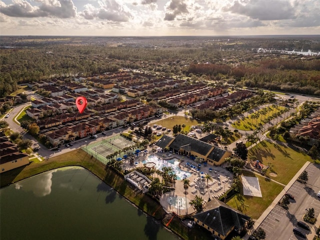 birds eye view of property with a water view