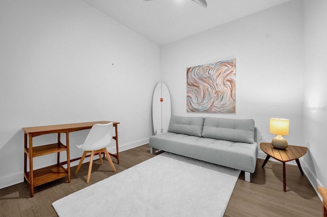 sitting room with dark hardwood / wood-style flooring