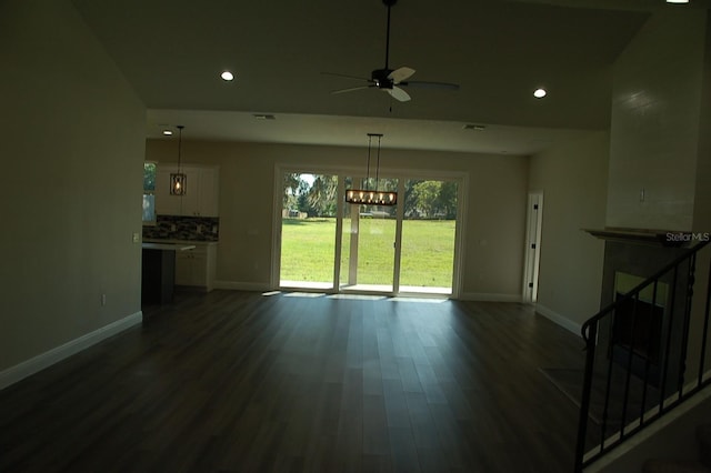 interior space featuring dark hardwood / wood-style flooring and ceiling fan