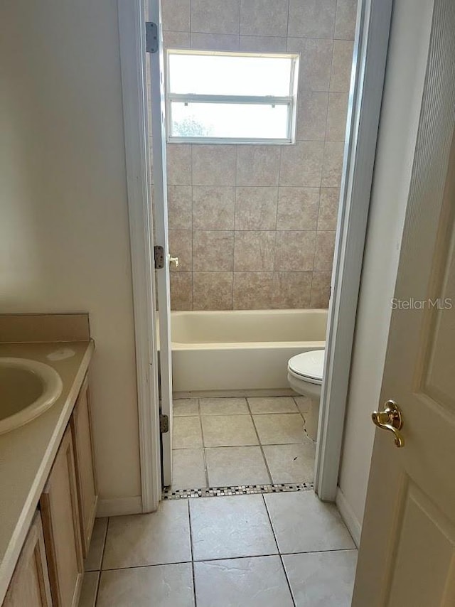 bathroom featuring toilet, vanity, and tile patterned floors