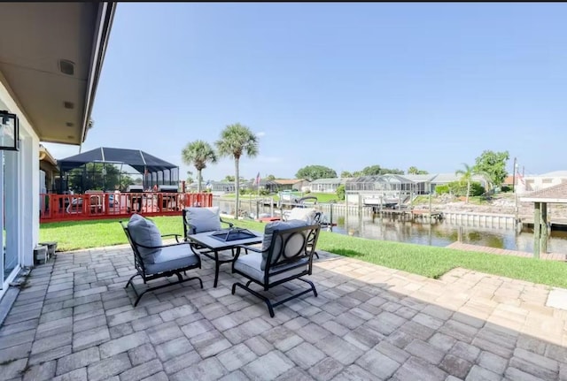 view of patio / terrace featuring a boat dock and a water view