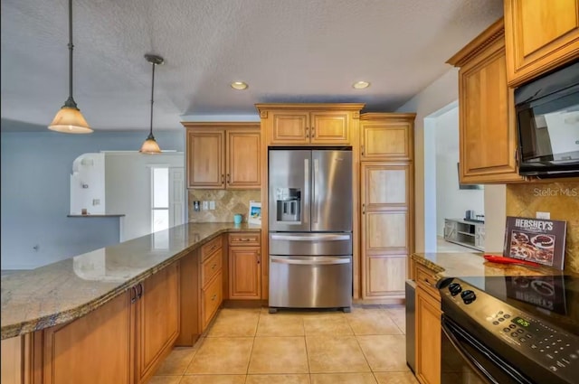 kitchen featuring backsplash, black appliances, pendant lighting, light tile patterned floors, and stone counters