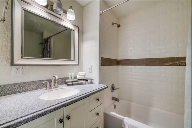 bathroom featuring vanity and shower / tub combo with curtain