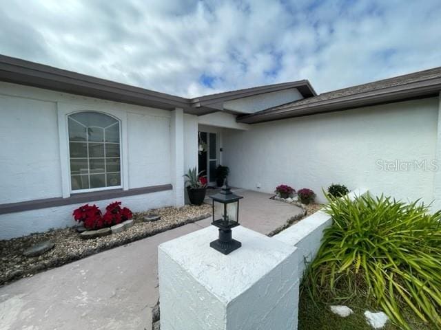 property entrance with a patio area