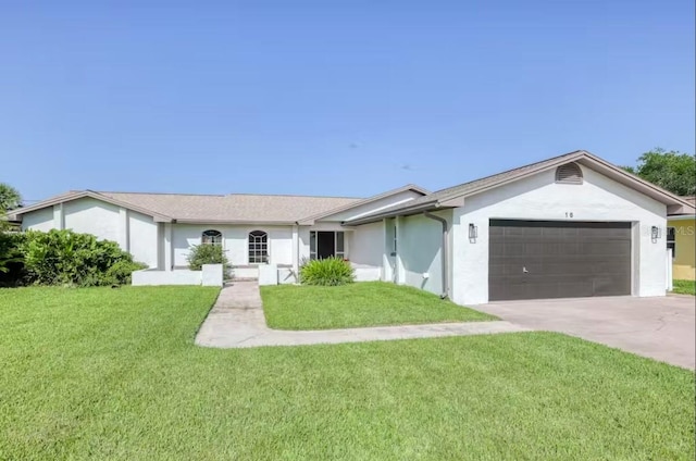 ranch-style home featuring a front lawn and a garage