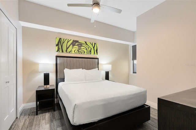 bedroom featuring ceiling fan, a closet, and hardwood / wood-style flooring