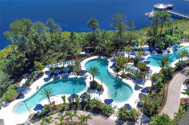 birds eye view of property with a water view