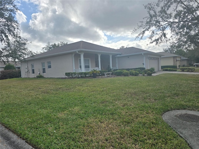 ranch-style home with a porch, a front yard, and a garage