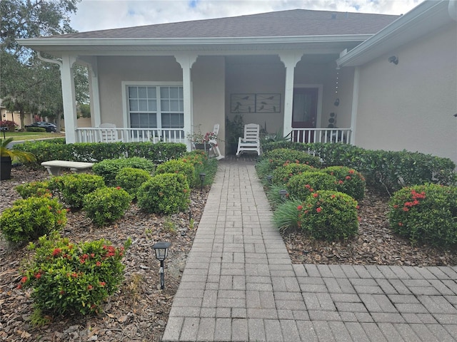 property entrance featuring covered porch