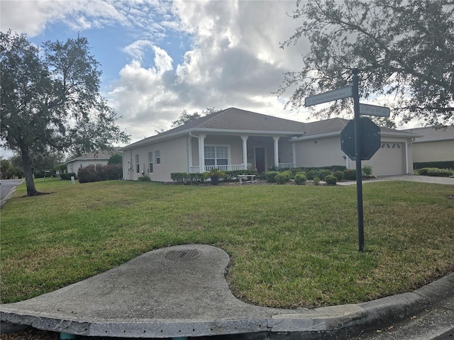 ranch-style house featuring a front lawn, a porch, and a garage