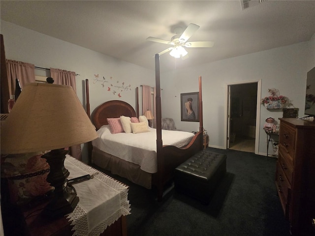 carpeted bedroom featuring ensuite bath and ceiling fan